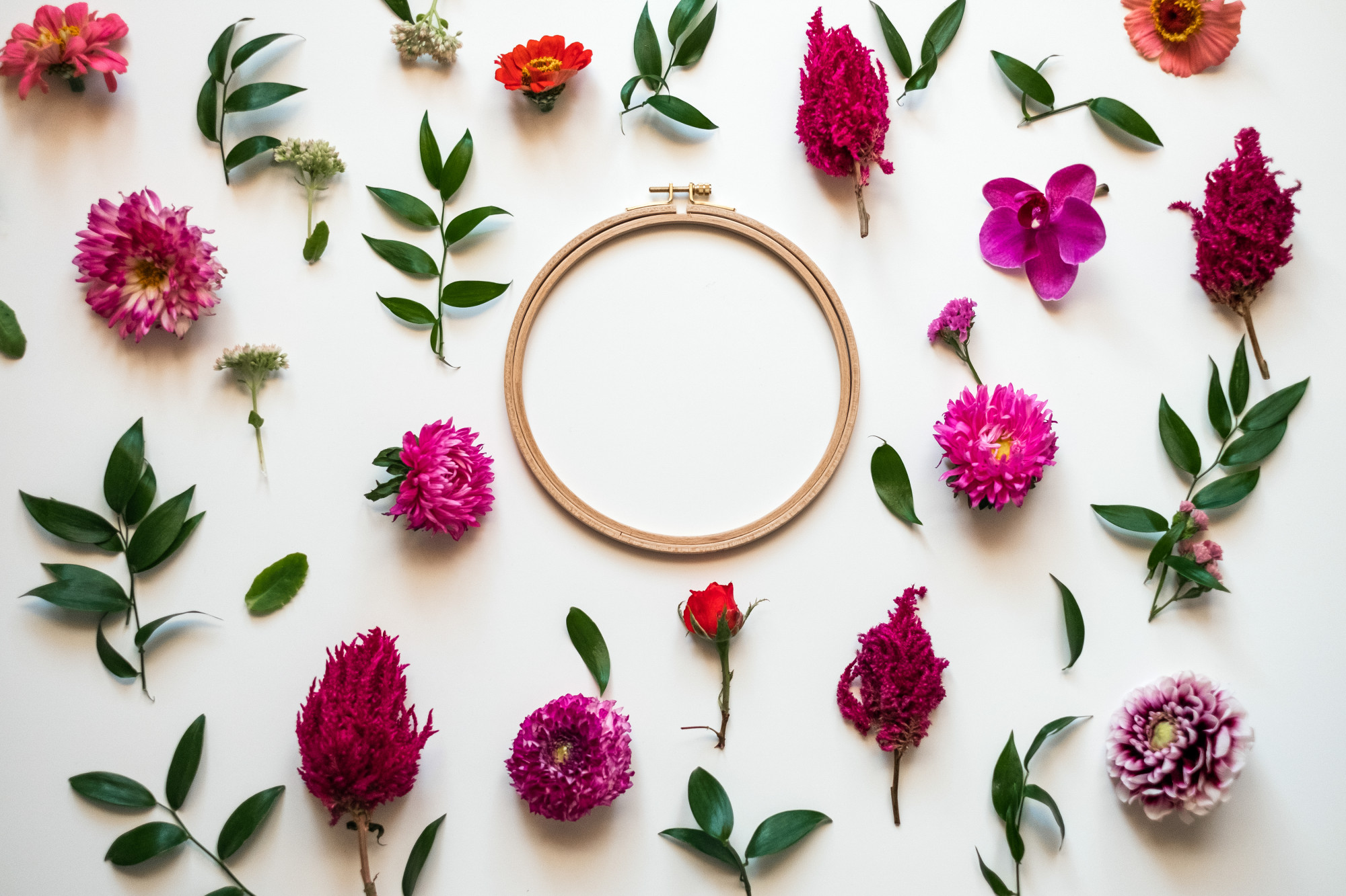 Close-up of embroidered floral hoop on fabric